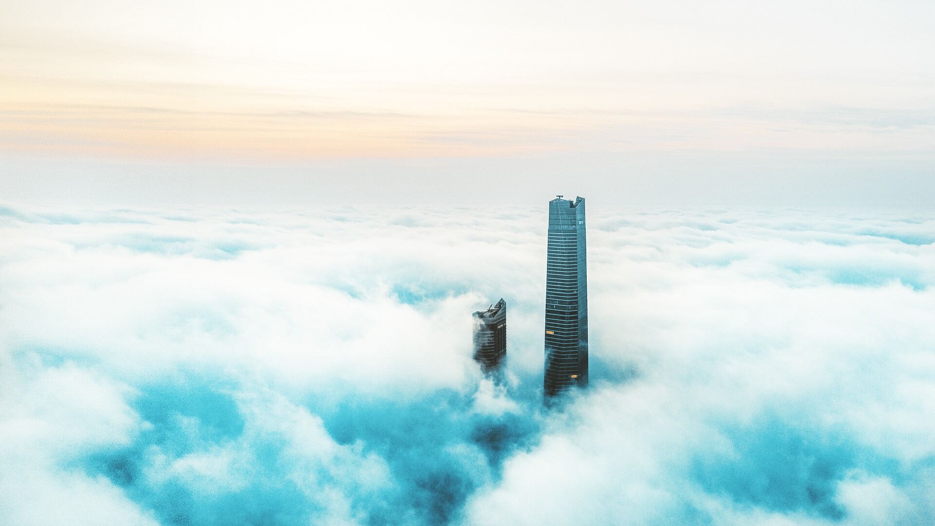 Skyscrapers emerging from clouds
